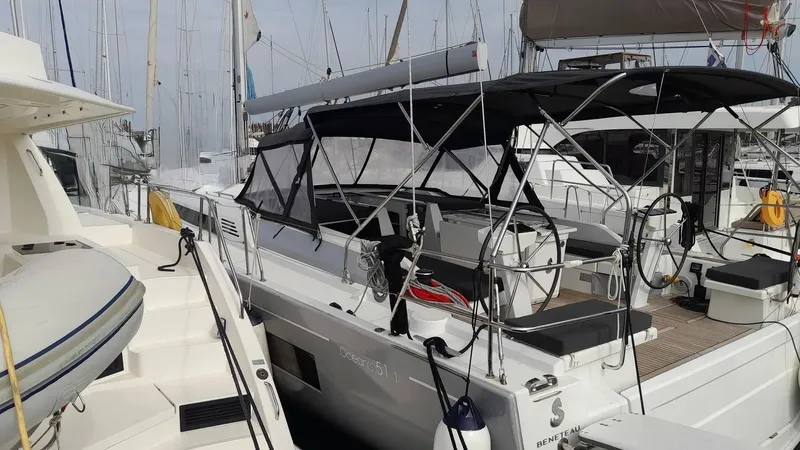 1725 Yacht Photos Pics 2022 Beneteau Oceanis 51.1 yacht docked at marina, featuring sleek design and spacious deck.