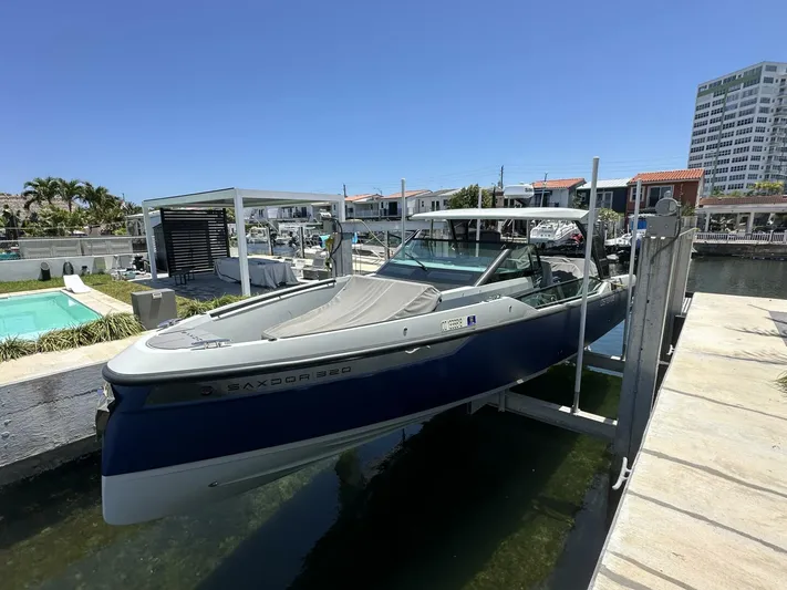  Yacht Photos Pics 2022 Saxdor 320 GTO boat docked in a sunny marina setting.