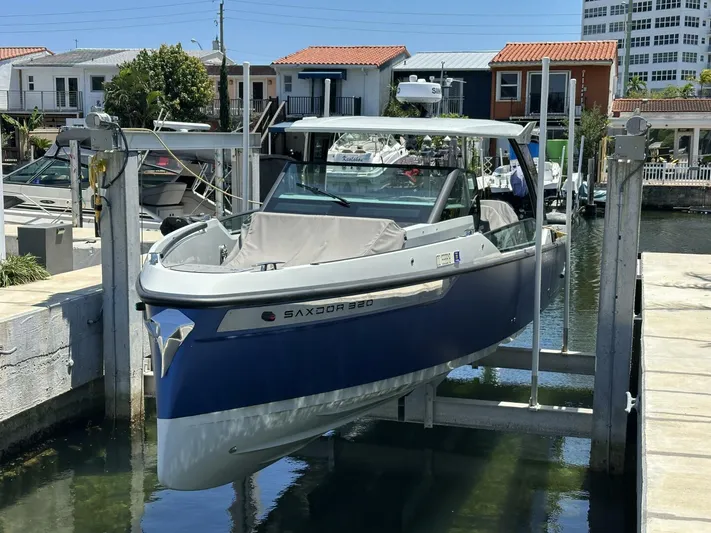  Yacht Photos Pics 2022 Saxdor 320 GTO boat docked in a marina, featuring sleek design and modern amenities.