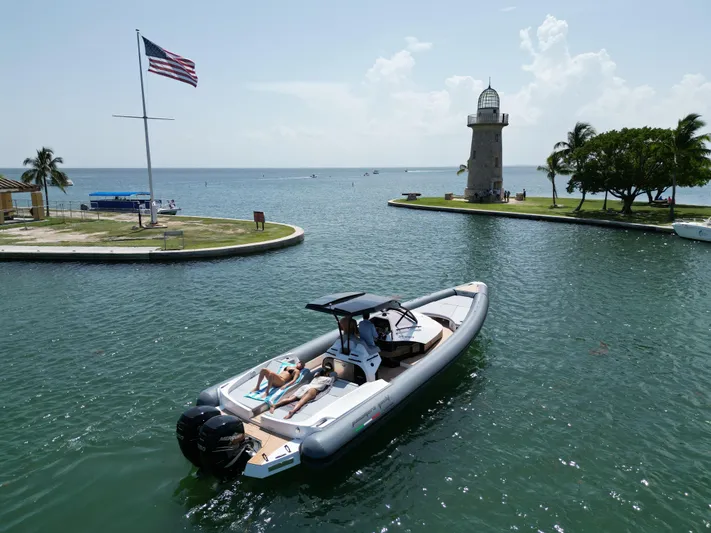  Yacht Photos Pics Panamera Yacht PY 100 (2025) cruising near a lighthouse and American flag.