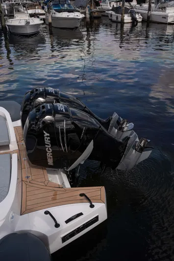  Yacht Photos Pics 2025 Panamera Yacht PY 100 with dual Mercury outboard engines at marina.