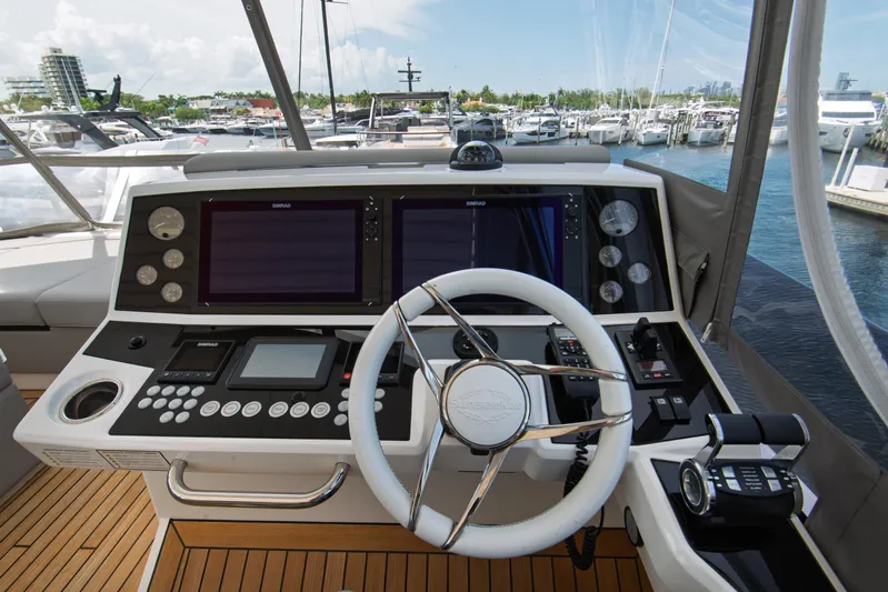  Yacht Photos Pics Helm of 2020 Sunseeker 76 Yacht with modern navigation equipment and steering wheel.