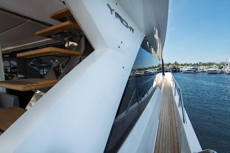  Yacht Photos Pics Sunseeker 76 Yacht 2020, sleek design, docked at marina, wooden deck, modern staircase.