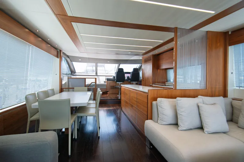  Yacht Photos Pics Luxurious interior of 2020 Sunseeker 76 Yacht with modern dining and seating area.