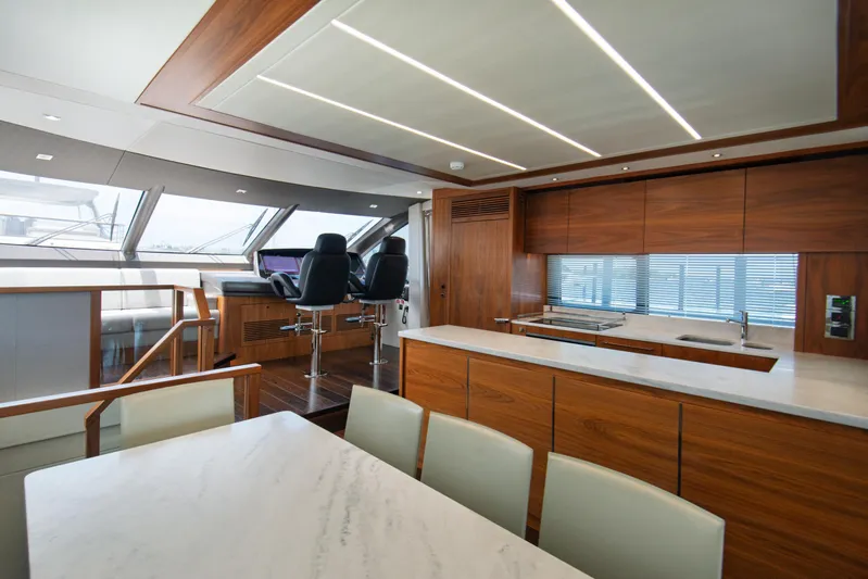  Yacht Photos Pics Luxurious interior of 2020 Sunseeker 76 Yacht with modern kitchen and helm station.