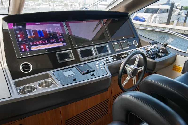 Yacht Photos Pics Helm of 2020 Sunseeker 76 Yacht with advanced navigation displays and controls.