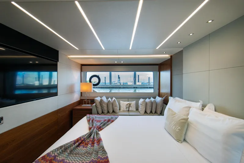  Yacht Photos Pics Luxurious Sunseeker 76 Yacht 2020 bedroom with modern design and waterfront view.
