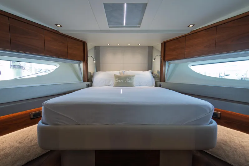  Yacht Photos Pics Luxurious bedroom interior of 2020 Sunseeker 76 Yacht with modern design and elegant wood finishes.