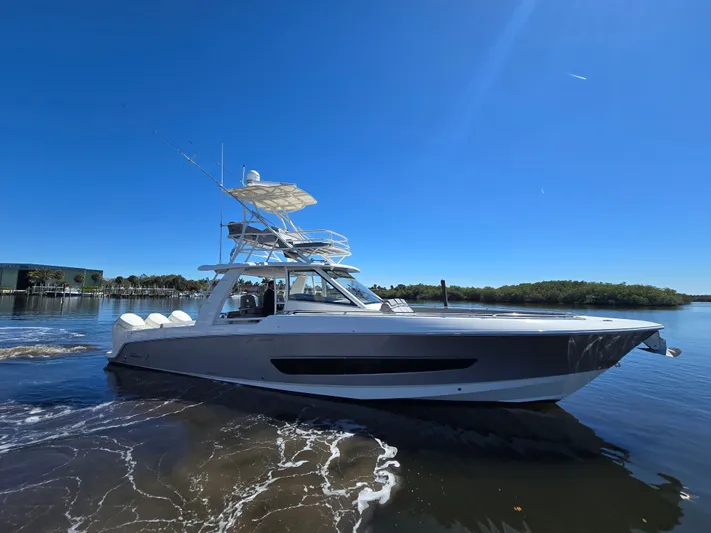  Yacht Photos Pics 2023 Boston Whaler 420 Outrage on calm water under clear sky.