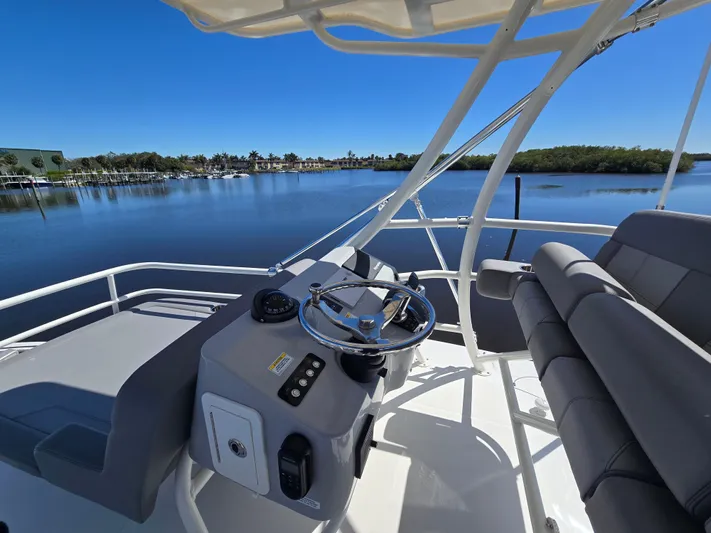 Yacht Photos Pics Helm of 2023 Boston Whaler 420 Outrage on calm waters.