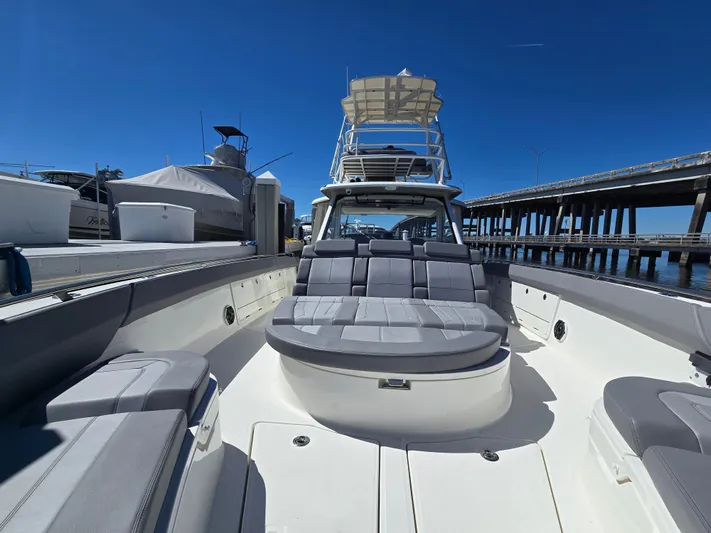  Yacht Photos Pics Boston Whaler 420 Outrage 2023 at dock with bridge in background.