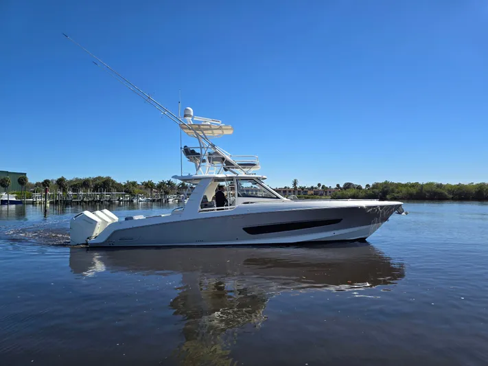  Yacht Photos Pics Boston Whaler 420 Outrage 2023 on calm water under clear sky.