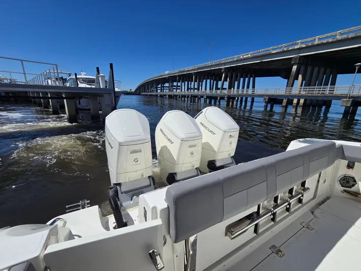  Yacht Photos Pics Boston Whaler 420 Outrage 2023 with three Mercury engines at dock.
