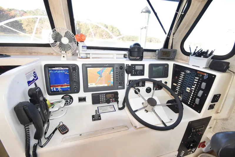 Ocean Explorer Yacht Photos Pics Control panel of a 2006 Custom 45 Doucette boat with navigation equipment.