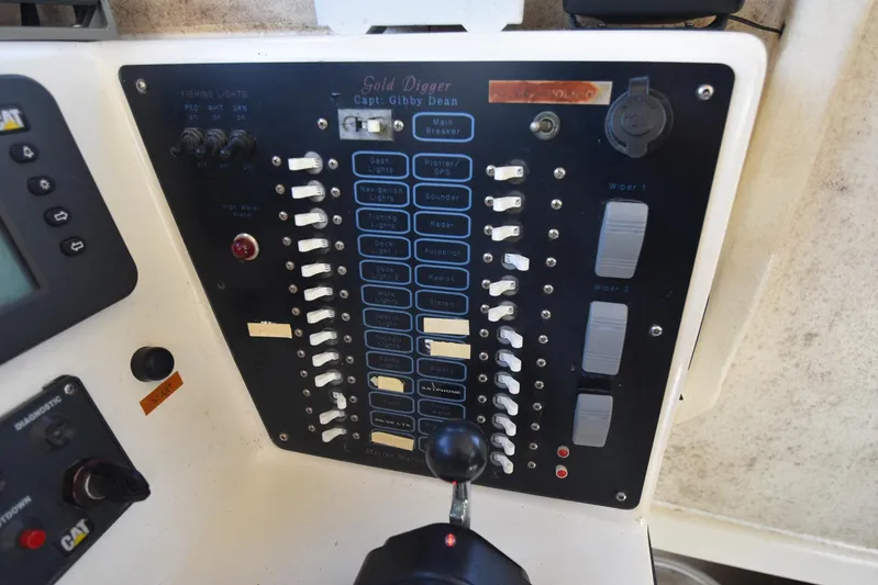Ocean Explorer Yacht Photos Pics Control panel of a 2006 Custom 45 Doucette boat with labeled switches and indicators.