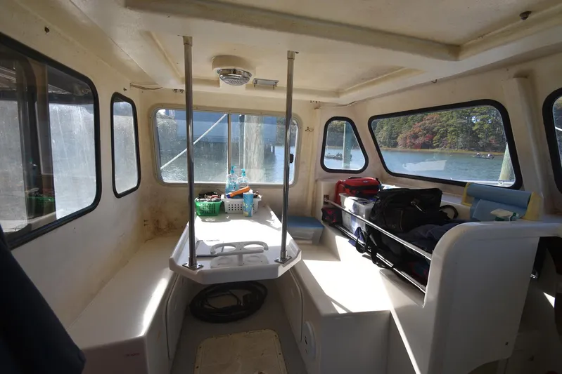 Ocean Explorer Yacht Photos Pics Interior of a 2006 Custom 45 Doucette boat with seating and storage.