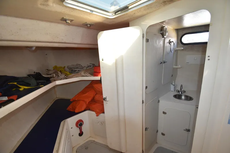 Ocean Explorer Yacht Photos Pics Interior of 2006 Custom 45 Doucette boat with compact cabin and sink area.