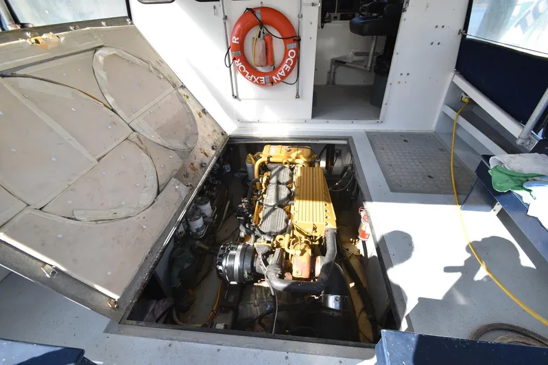 Ocean Explorer Yacht Photos Pics Engine compartment of 2006 Custom 45 Doucette boat with visible machinery and safety equipment.
