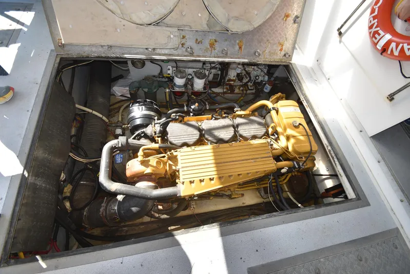 Ocean Explorer Yacht Photos Pics Engine compartment of a 2006 Custom 45 Doucette boat, showcasing detailed machinery.