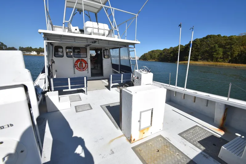 Ocean Explorer Yacht Photos Pics Custom 45 Doucette boat, 2006 model, on calm water with clear blue sky.