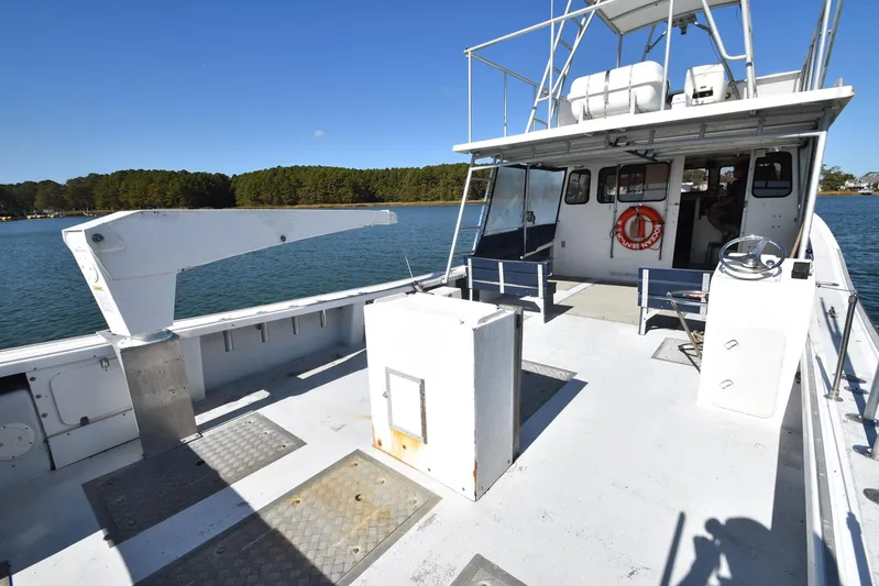 Ocean Explorer Yacht Photos Pics Custom 45 Doucette boat, 2006 model, on calm water with clear blue sky.