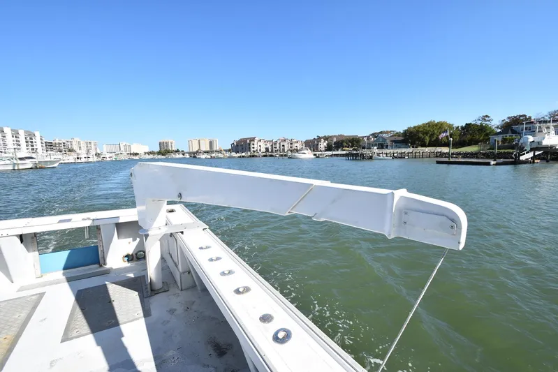 Ocean Explorer Yacht Photos Pics Custom 45 Doucette boat, 2006 model, cruising in a scenic waterfront area.