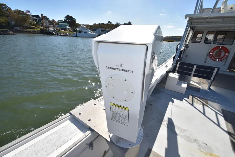 Ocean Explorer Yacht Photos Pics Boat deck with equipment, Custom 45 Doucette, 2006, docked by waterfront homes.