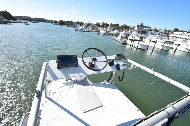 Ocean Explorer Yacht Photos Pics Boat helm with navigation equipment overlooking marina, Custom 45 Doucette, 2006 model.
