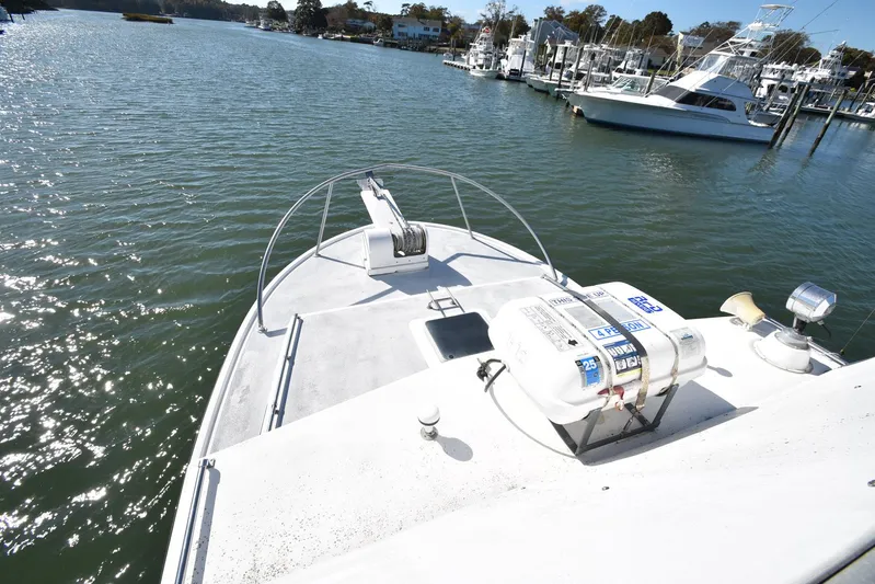 Ocean Explorer Yacht Photos Pics Bow view of 2006 Custom 45 Doucette boat docked in a marina.