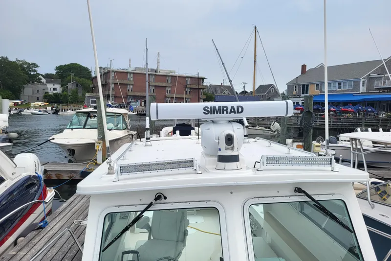  Yacht Photos Pics 2023 Steiger Craft 31 Fisherman docked, featuring Simrad radar system.