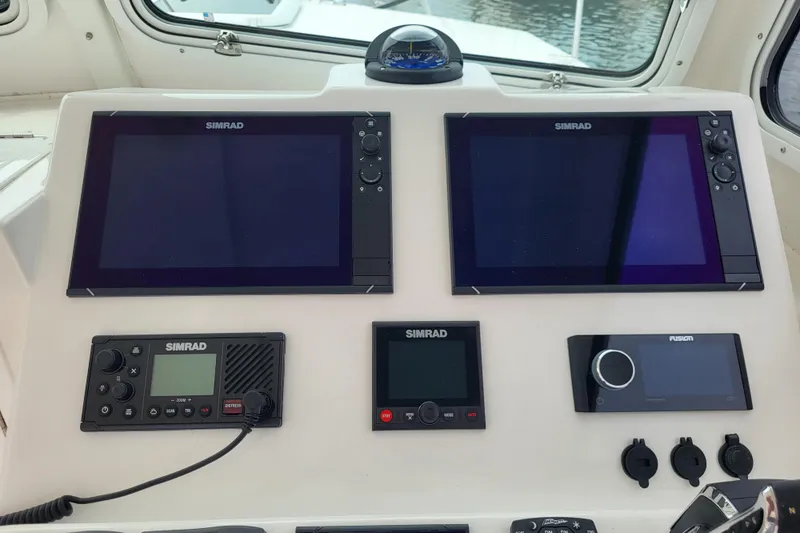  Yacht Photos Pics 2023 Steiger Craft 31 Fisherman dashboard with Simrad navigation and control systems.