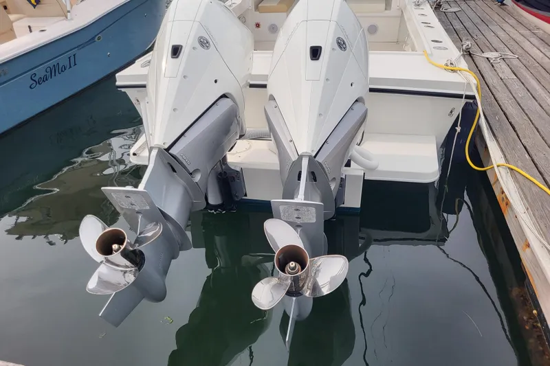  Yacht Photos Pics 2023 Steiger Craft 31 Fisherman with dual outboard motors docked at marina.