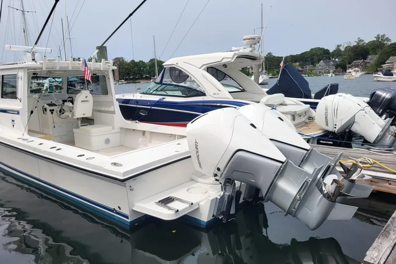 Yacht Photos Pics 2023 Steiger Craft 31 Fisherman boat docked with powerful outboard engines.