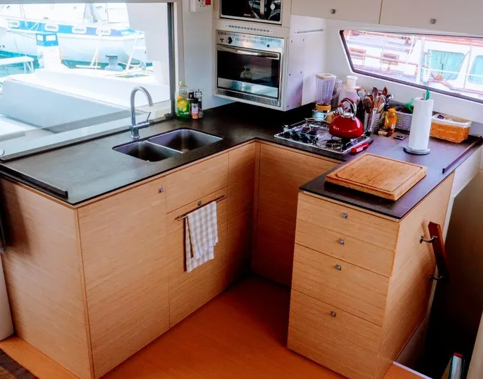 Raiatea Yacht Photos Pics Modern kitchen in a 2015 Bali 4.5 yacht with sleek countertops and appliances.