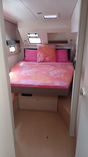 Raiatea Yacht Photos Pics Cozy bedroom in 2015 Bali 4.5 yacht with pink bedding and natural light.