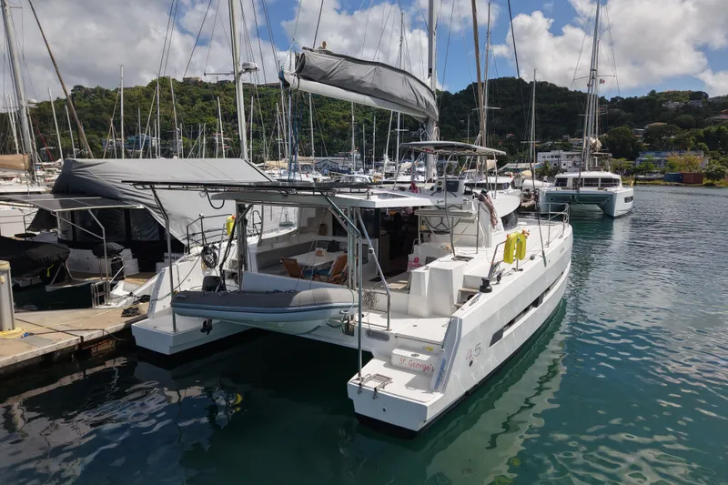 Raiatea Yacht Photos Pics 2015 Bali 4.5 catamaran docked in a marina, surrounded by other boats.