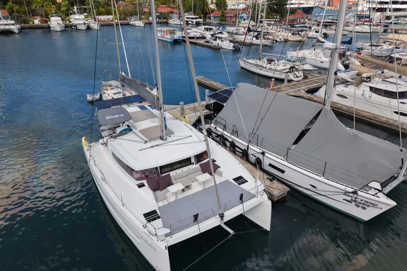 Raiatea Yacht Photos Pics Bali 4.5 catamaran docked in a marina, surrounded by other boats, 2015 model.