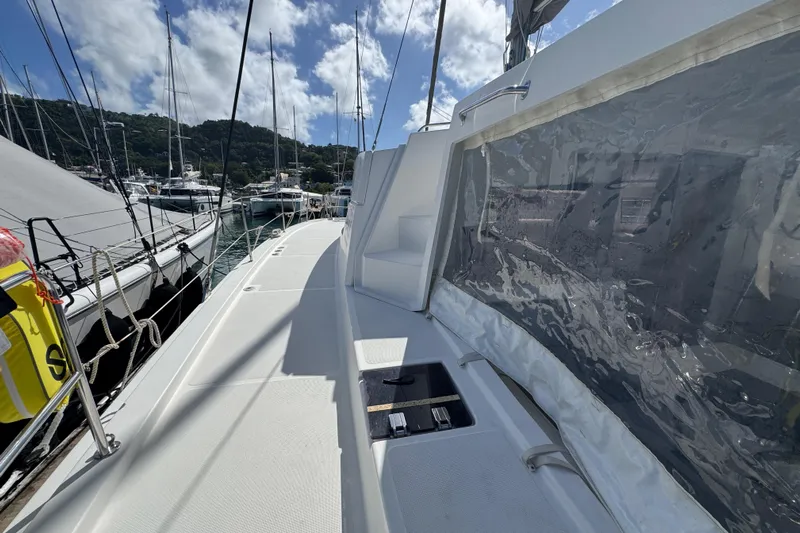Raiatea Yacht Photos Pics Bali 4.5 catamaran deck, 2015 model, docked at marina under blue sky.