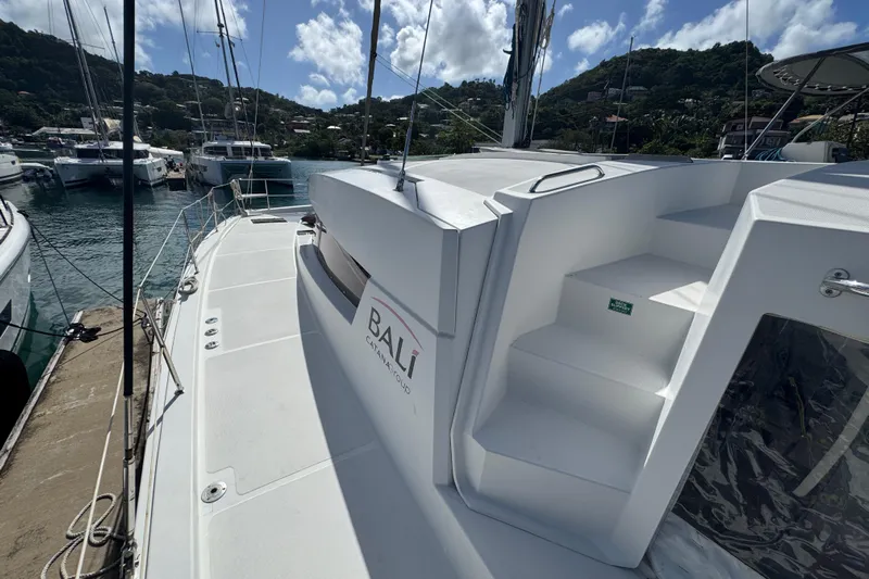 Raiatea Yacht Photos Pics Bali 4.5 catamaran docked at marina, 2015 model, sunny day, scenic background.