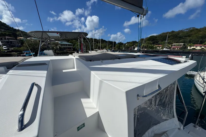 Raiatea Yacht Photos Pics Bali 4.5 catamaran deck, 2015 model, docked in a scenic marina under blue skies.