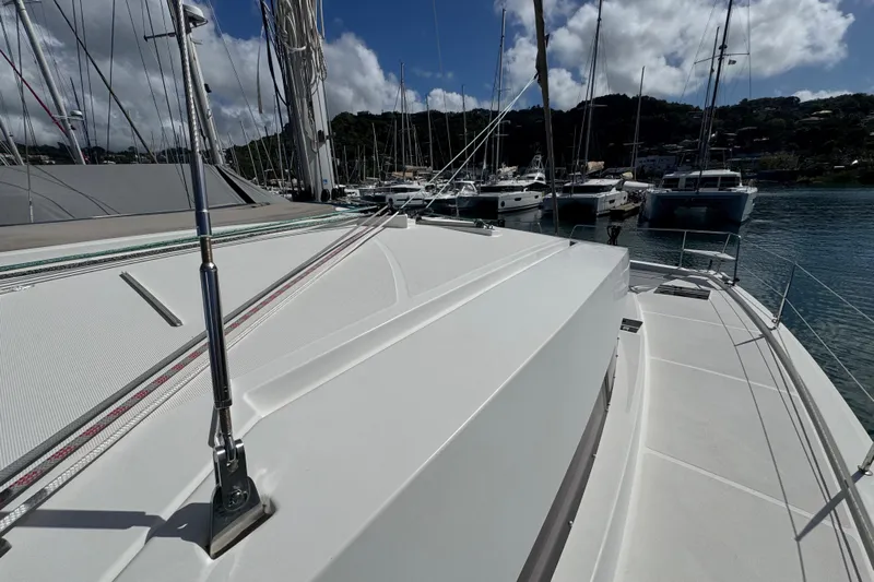 Raiatea Yacht Photos Pics 2015 Bali 4.5 catamaran docked in a marina under a clear blue sky.