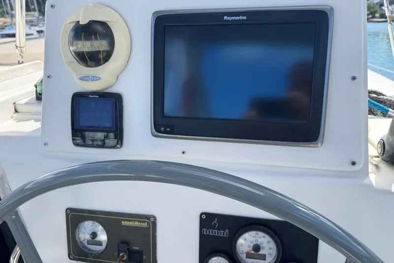 Raiatea Yacht Photos Pics Boat dashboard with navigation instruments, featuring Raymarine display, Bali 4.5 model, 2015.