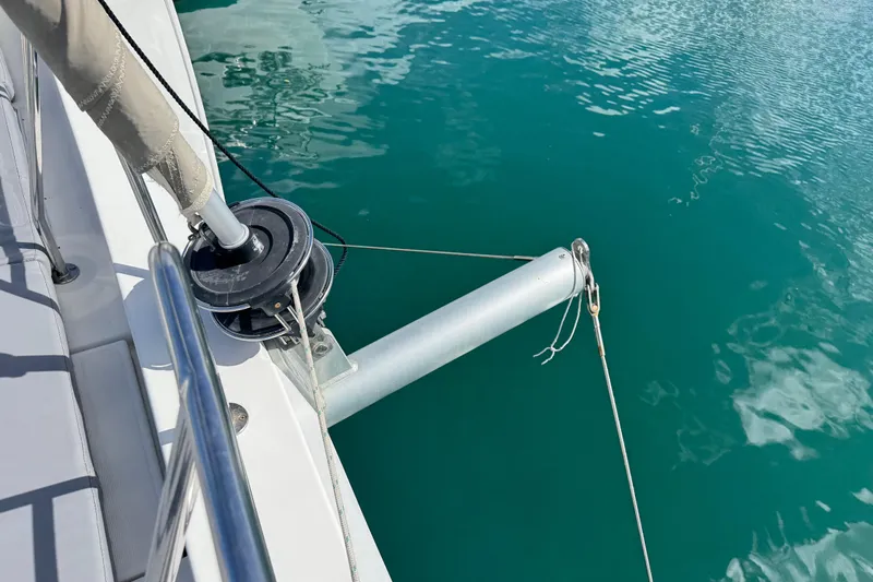 Raiatea Yacht Photos Pics Sailboat deck with rigging, Bali 4.5 model, 2015, on clear turquoise water.