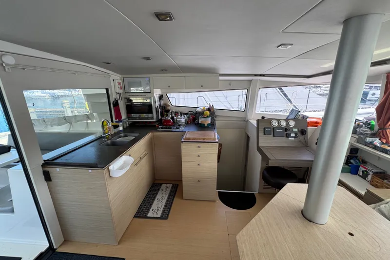 Raiatea Yacht Photos Pics Interior of 2015 Bali 4.5 catamaran with modern kitchen and navigation area.