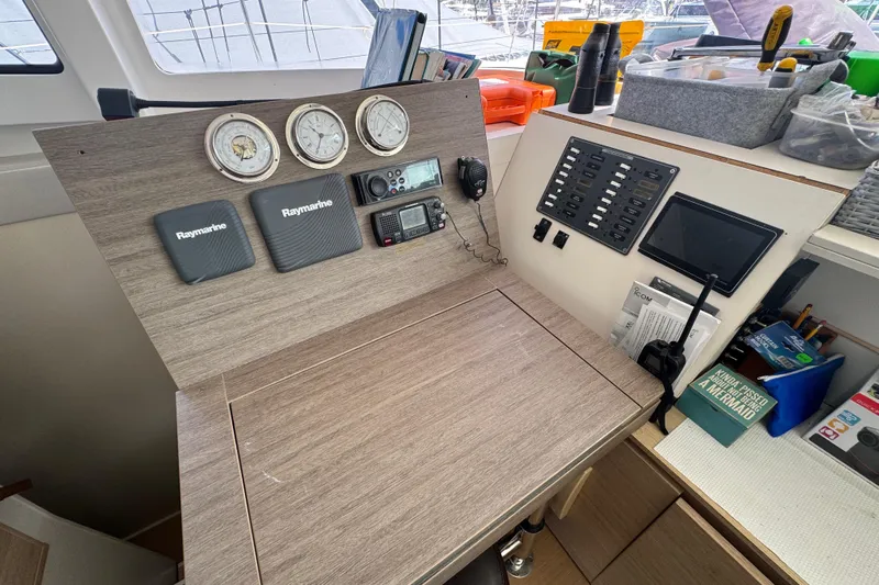 Raiatea Yacht Photos Pics Navigation station on a 2015 Bali 4.5 catamaran with Raymarine equipment and control panel.