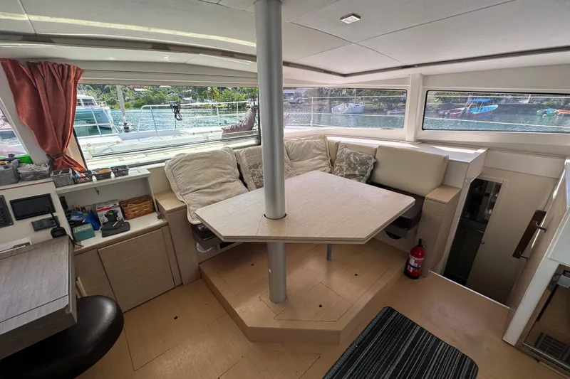 Raiatea Yacht Photos Pics Interior of a 2015 Bali 4.5 catamaran with cozy seating and scenic window views.