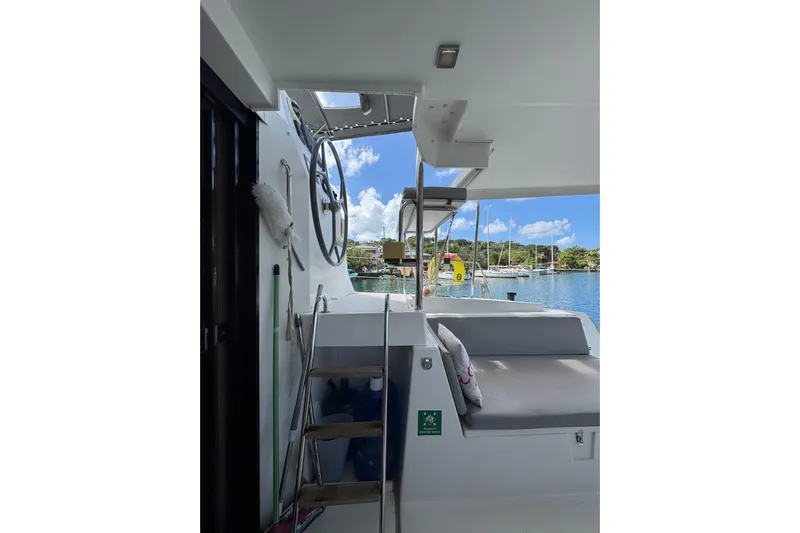 Raiatea Yacht Photos Pics Interior view of 2015 Bali 4.5 catamaran with seating and steering wheel.