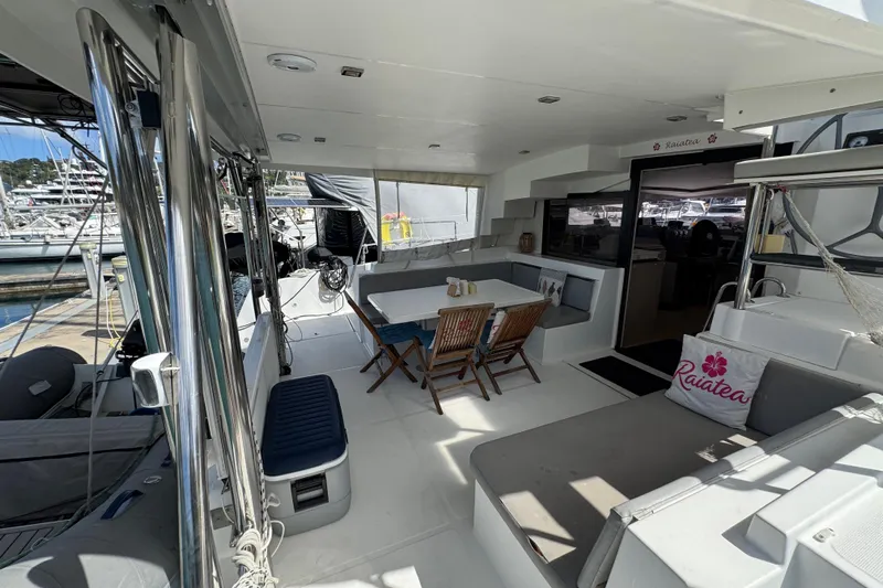 Raiatea Yacht Photos Pics Spacious deck of 2015 Bali 4.5 catamaran with seating and dining area.