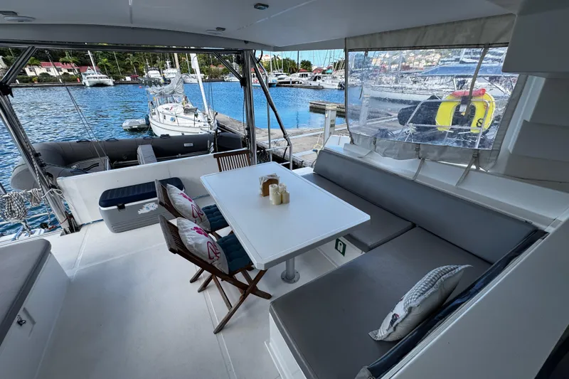 Raiatea Yacht Photos Pics Spacious Bali 4.5 yacht interior with dining area, docked at marina, 2015 model.