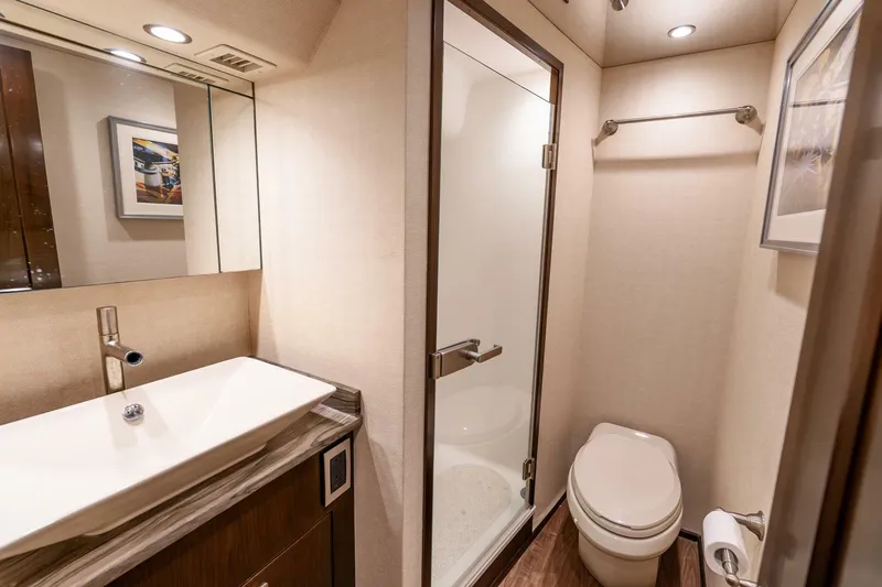 The Provider Yacht Photos Pics Luxurious bathroom in 2015 Viking 76 Convertible yacht with modern fixtures and shower.